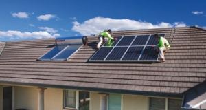 solar installers working on roof